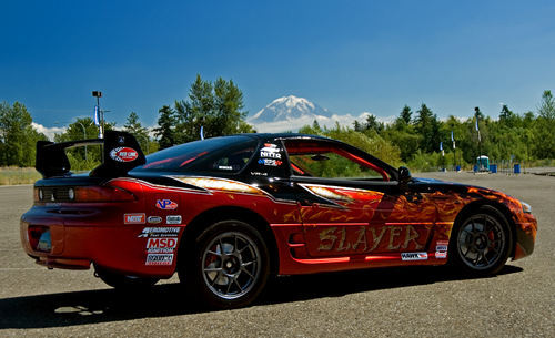 NW3S's 3000GT VR4 Racecar sideview showing hammered metal,flames slayer in the kandy custom paint job.