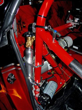 AEM water injection system pump mounted to roll bar